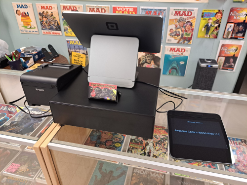 Awesome Comics, Dallas' Premiere Comic Shop with our new Secret Headquarters, 10% off walk-in special on everything in the store, excluding sale items. Subscription subscribers get 20% off all new comics, and 15% off everything else in the store not already on sale.